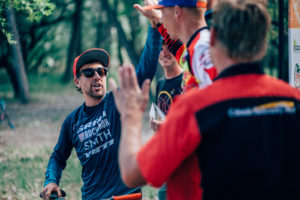 Racers high five each other for an Enduro well raced.
