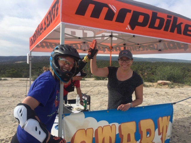 Dana Vanvoorhees, left, gets a high five for her Grand Enduro race time.